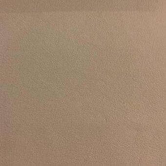 Rugiano indoor leather swatch, neutral tan color, fine pebbled texture, smooth finish, model nu 234, natural grain surface.